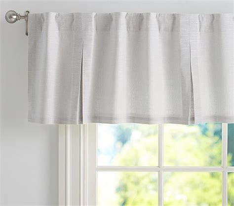 The addition of extra lighting, such as table or floor lamps, chandeliers and sconces throughout can evoke a cozy, intimate feel to the room. . Pottery barn valances
